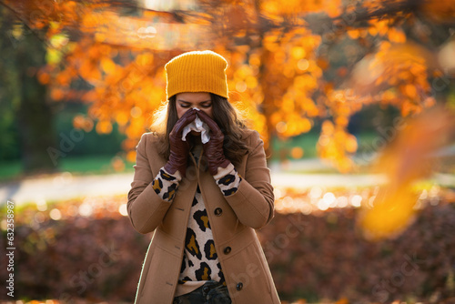 Принти на полотні elegant woman in beige coat and orange hat