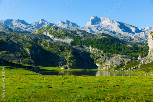 Picturesque rocky landscape with mountain range above lake of Covadonga in summer day, Spain ..