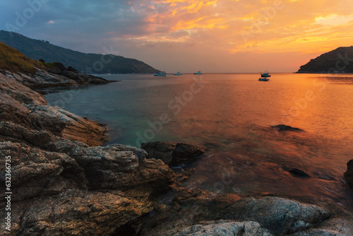 Beautiful sunset on the rock beach.