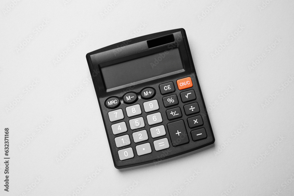 Calculator on light gray background, top view. Office equipment Calculator on light gray background, top view. Office equipment