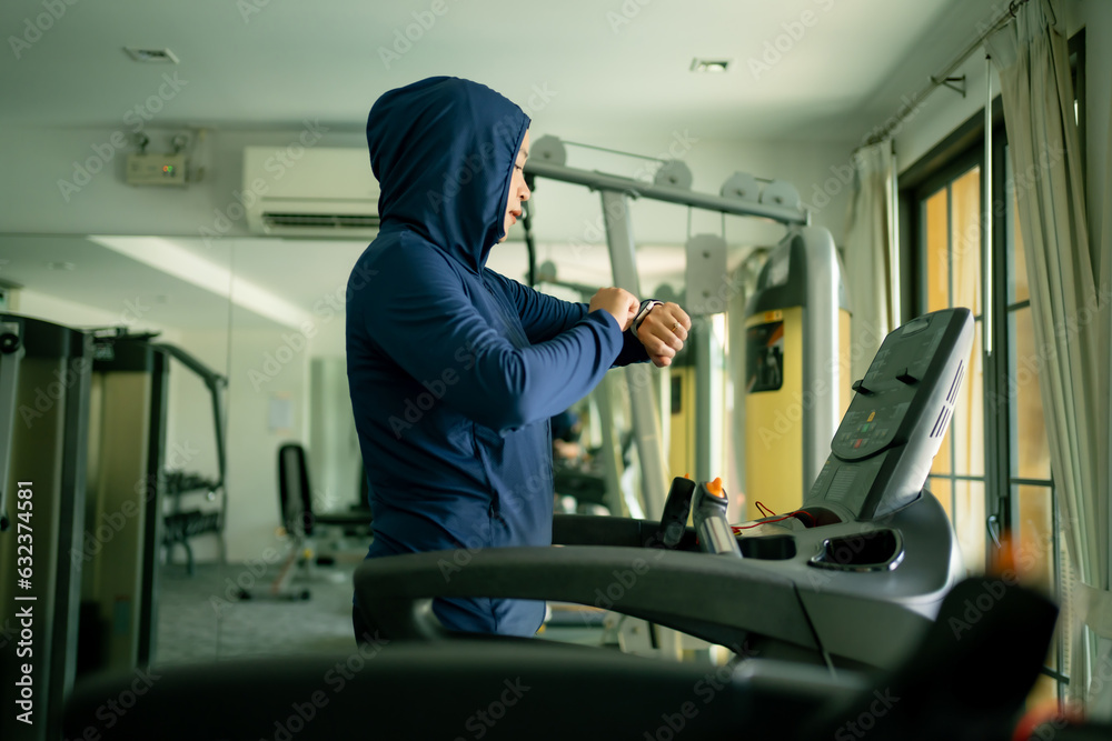 Athletic Asian Muslim Sports Woman Wearing Hijab and Sportswear Running on Treadmill. Energetic Fit Female Athlete Training in Gym Alone. Urban Business District Window View.
concept of muslim sport. Athletic Asian Muslim Sports Woman Wearing Hijab and Sportswear Running on Treadmill. Energetic Fit Female Athlete Training in Gym Alone. Urban Business District Window View.
concept of muslim sport.