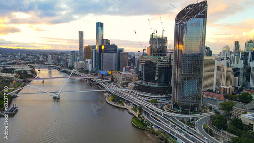 Aerial drone view of Brisbane City, QLD, Australia looking toward the west facing side of the city along Brisbane River and Riverside Expressway during late afternoon in August 2023     photo