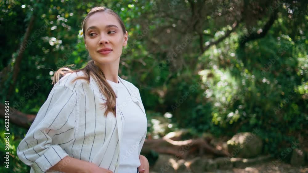 Gentle girl walking park at greenery summer day close up. Woman strolling forest Gentle girl walking park at greenery summer day close up. Woman strolling forest