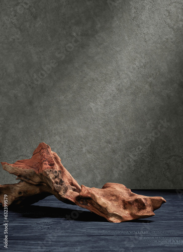 A piece of bark on an old blue wooden background and a glowing cement wall backdrop. Presentation for product concept. 3D rendering