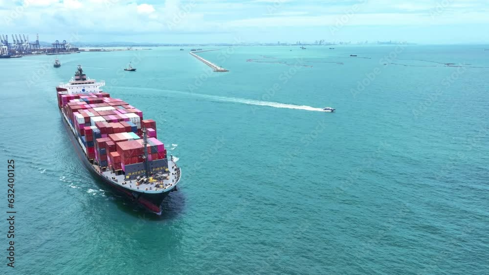 Aerial top view of cargo container ship working. Container bulk or Cargo Ship Large vessel running to yard port concept freight shipping ship. forwarder mast. import export Aerial top view of cargo container ship working. Container bulk or Cargo Ship Large vessel running to yard port concept freight shipping ship. forwarder mast. import export
