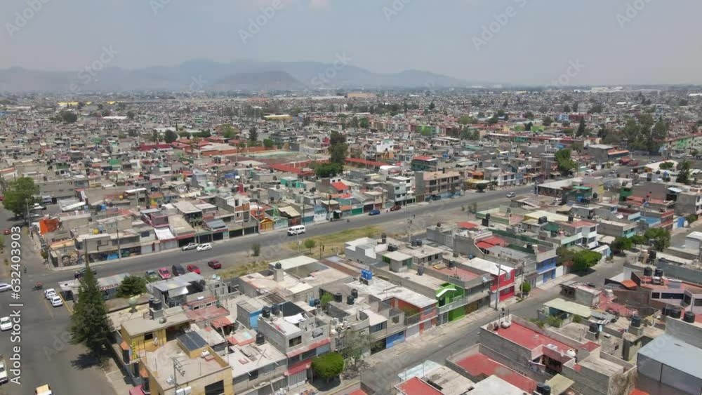 Aerial birds eye view ecatepec neighborhood panorama with residential houses and cars driving on roads. Mexico city. Metropolitan area in suburbs Aerial birds eye view ecatepec neighborhood panorama with residential houses and cars driving on roads. Mexico city. Metropolitan area in suburbs