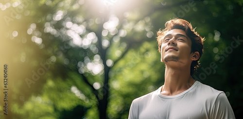Relaxed man breathing fresh air. Health and wellbeing concept.