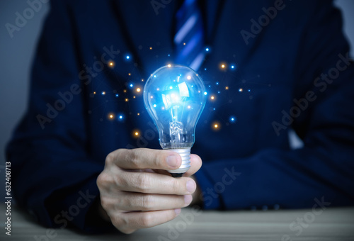 businessman holding a light bulb Digital technology. idea creative 