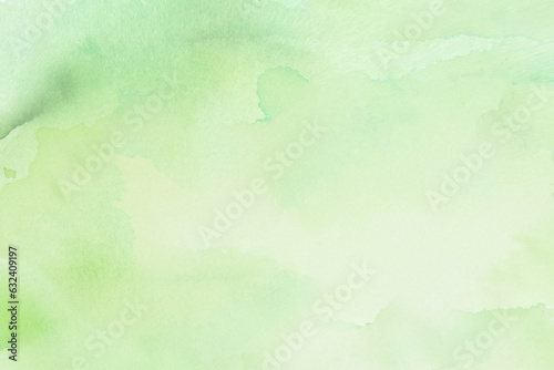 Abstract green pastel watercolor stains background on watercolor paper textured for design templates invitation card
