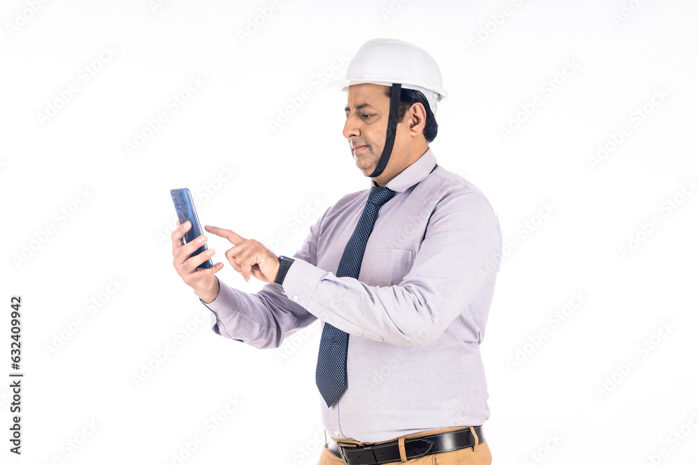 Engineer using smartphone on white background. Engineer using smartphone on white background.