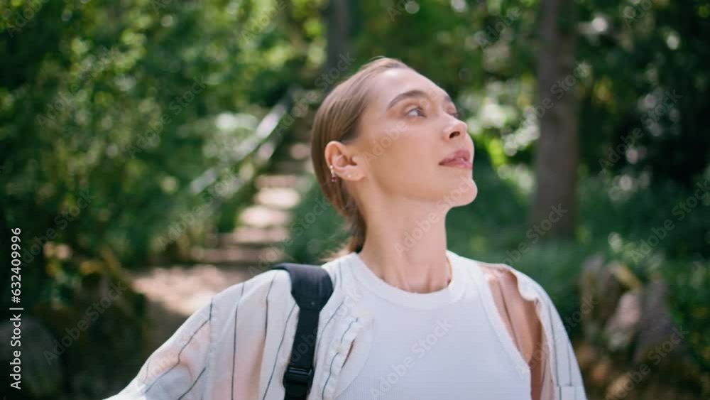 Active woman strolling park looking around on beautiful fresh greenery close up. Active woman strolling park looking around on beautiful fresh greenery close up.