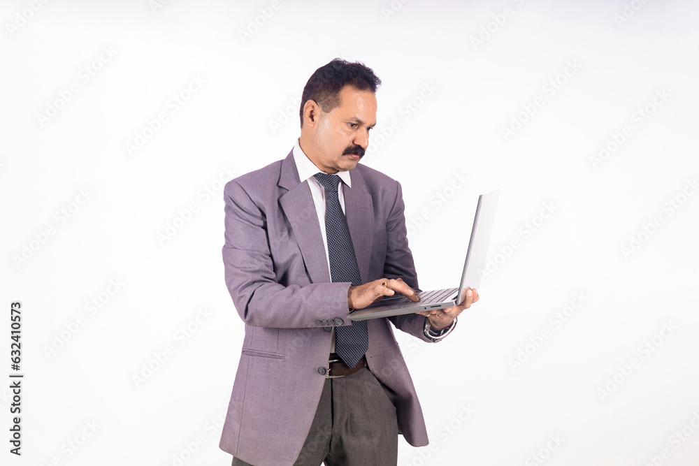 Indian businessman using laptop on white background. Indian businessman using laptop on white background.