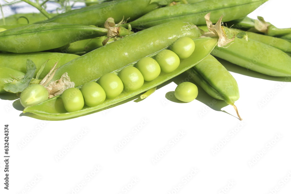 On a white background lie several pods of green peas with peas. On a white background lie several pods of green peas with peas.