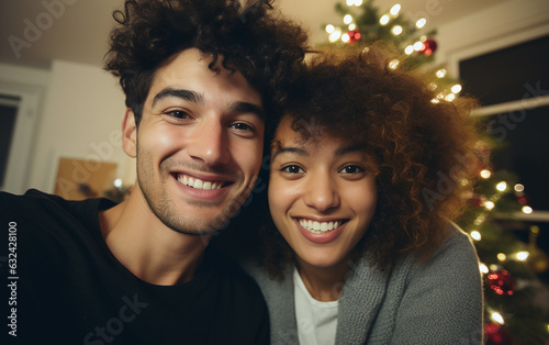 Multiracial young couple or family taking selfies on Christmas at home in modern apartment