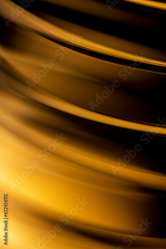 Abstract golden background, wallpaper of a elegant gold smooth wavy segments, photography design.
