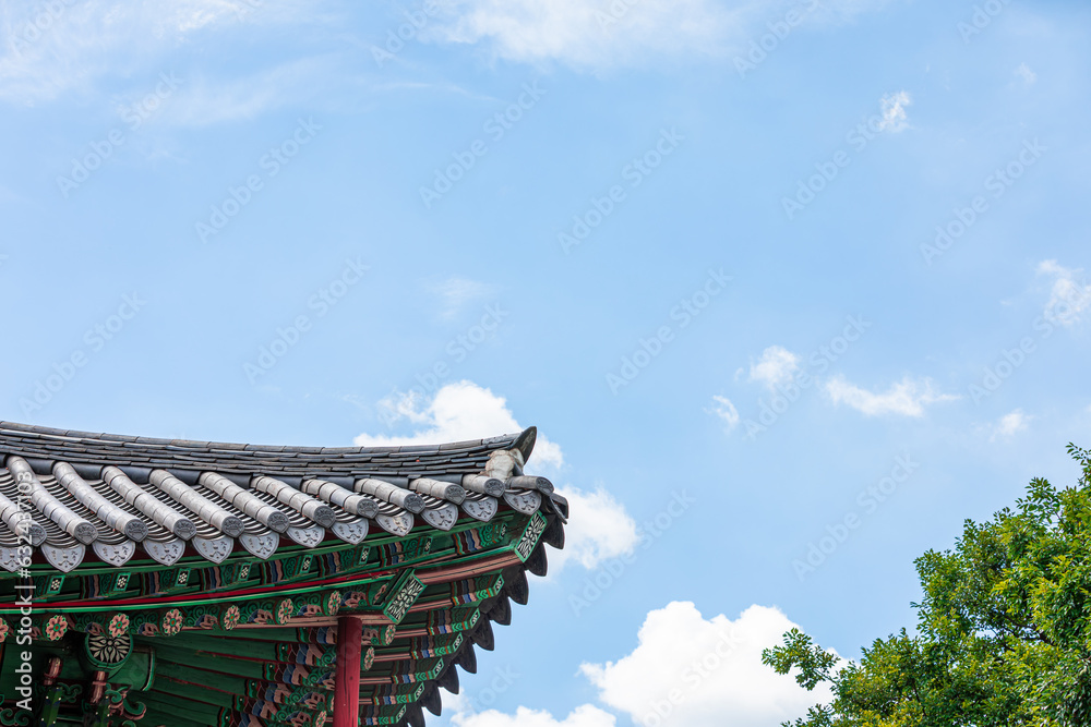 Korean traditional tiled roofs and colorful dancheong patterns. sunny day