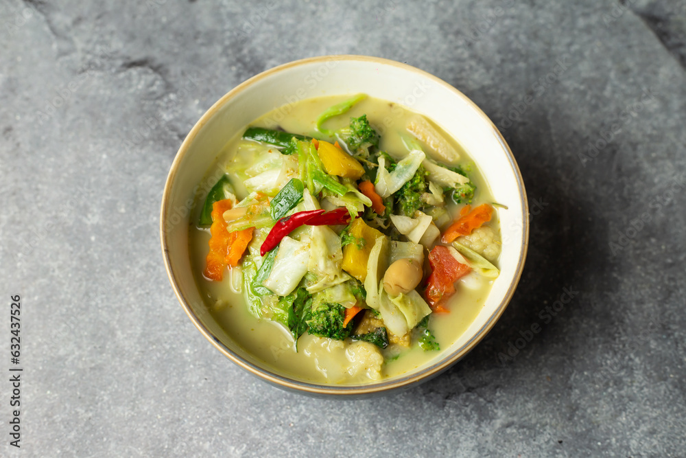Green Curry Vegetables served in dish isolated isolated on background top view of bangladesh food Green Curry Vegetables served in dish isolated isolated on background top view of bangladesh food
