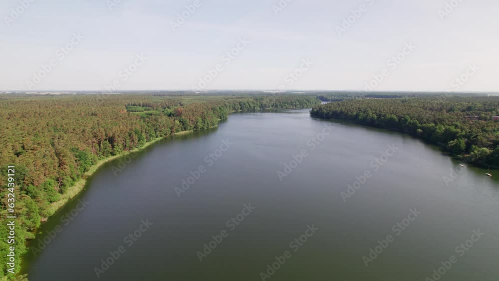 Lake in forest during summer, opening drone shot, tilt up Lake in forest during summer, opening drone shot, tilt up