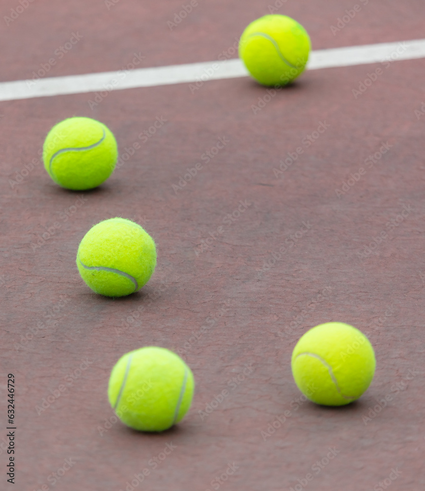 Yellow balls on the tennis court. Sport