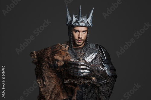 фотографія King wearing chainmail with reinforced steel plates, one shoulder covered by a f
