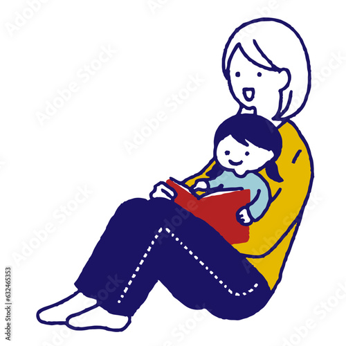 読み聞かせをする親子