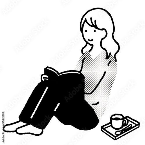 雑誌を読みながらコーヒーを飲む女性