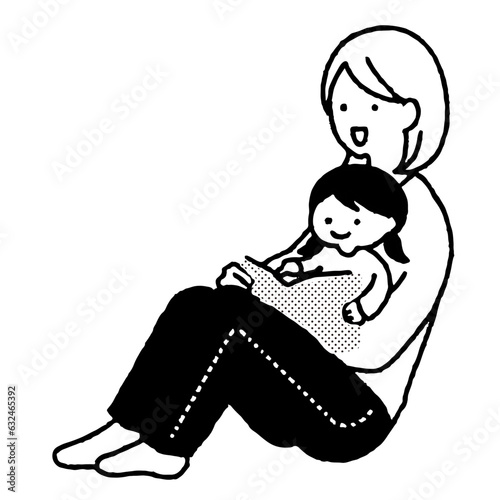 読み聞かせをする親子
