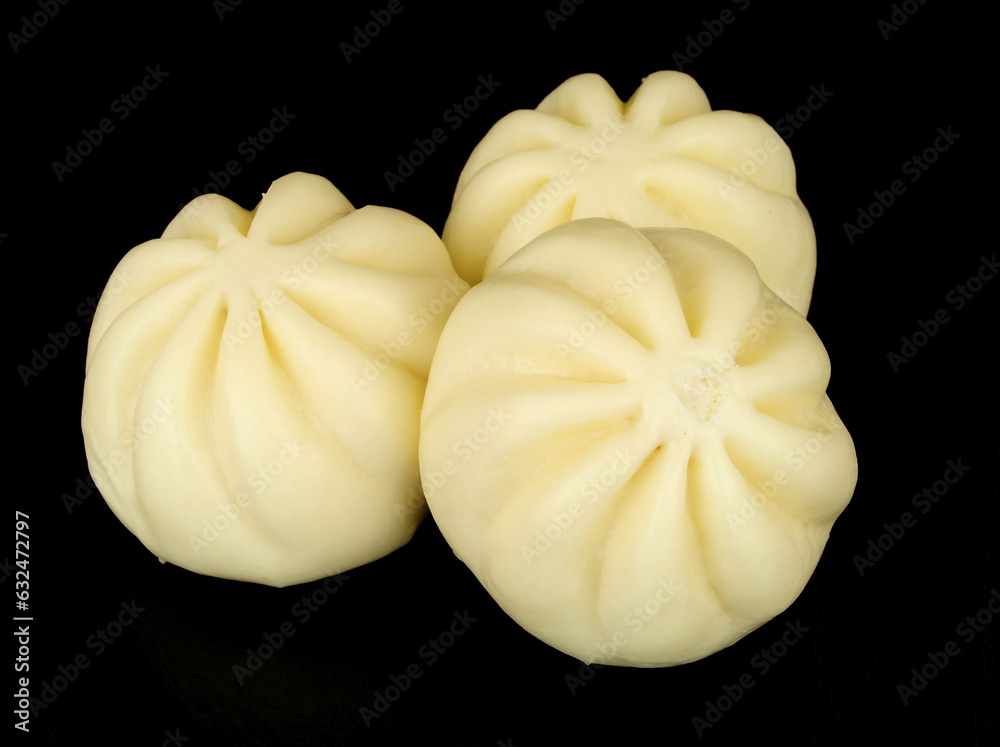 Group of steamed soft bao buns filled with hoisin sauce and duck meat Group of steamed soft bao buns filled with hoisin sauce and duck meat