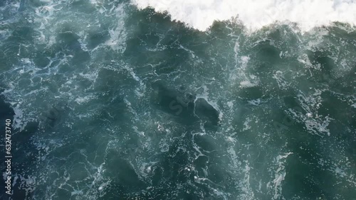 Top-Down Aerial Dance of Waves: Bali's Oceanic Majesty during Low Tide – 4K Drone Perspective