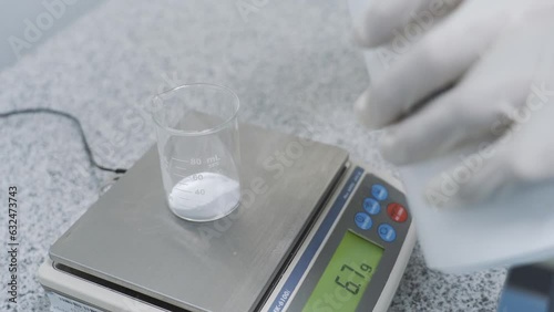 weight White powder in Beaker on Scales 4 gram to 11 gram Laboratory