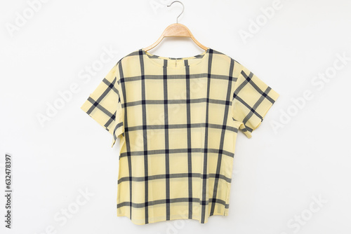Blouse with yellow sleeved plaid cotton on white background.