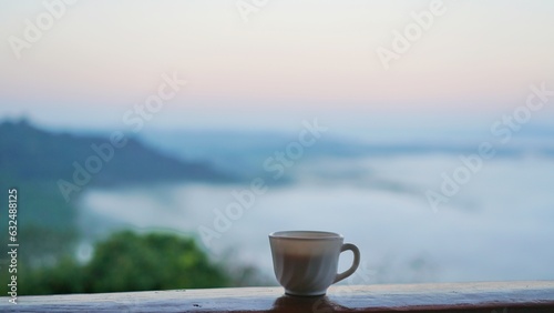 A cup of coffee with mountain view.