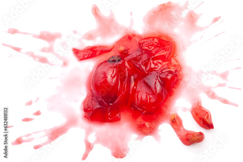 Smashed black currant berries isolated on white background