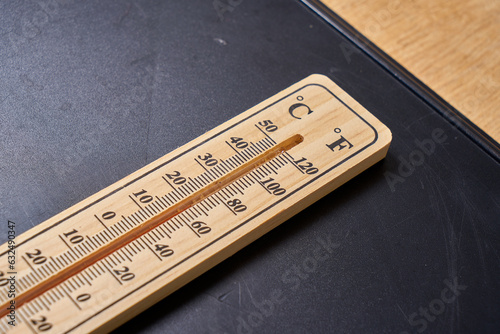 a vintage wooden thermometer