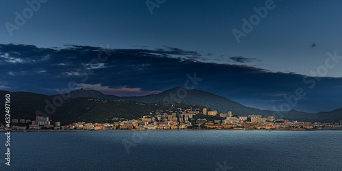 panorama of the city of Ajaccio at sunrise seen from the open sea