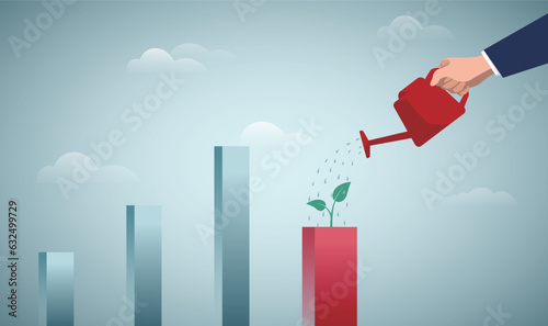 Economic recover from money stimulus, leadership to grow business, investment growth or profit and earning concept, businessman watering growing bar chart