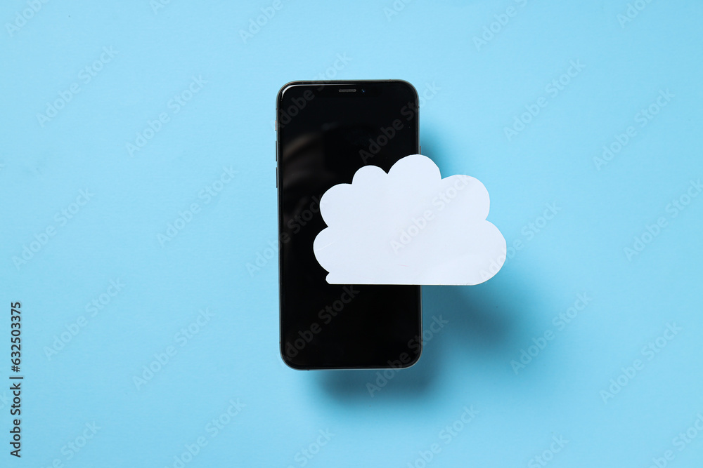 Black smartphone with a paper white cloud on a blue background Black smartphone with a paper white cloud on a blue background