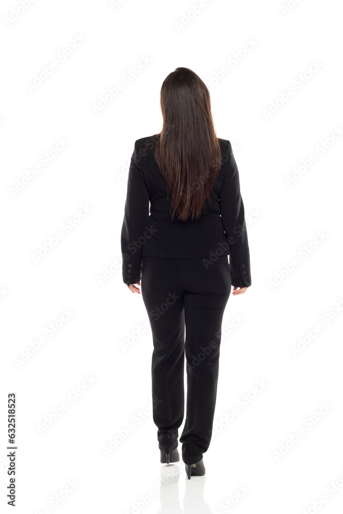 full body picture of businesswoman walking, standing and posing in a back view position on white background full body picture of businesswoman walking, standing and posing in a back view position on white background