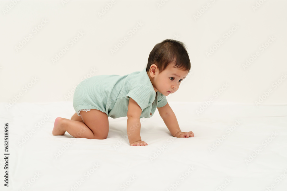 infant crawling on floor inside baby playpen infant crawling on floor inside baby playpen