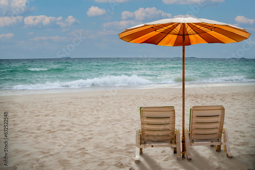 beach chairs and umbrella on the beach © BigKhem