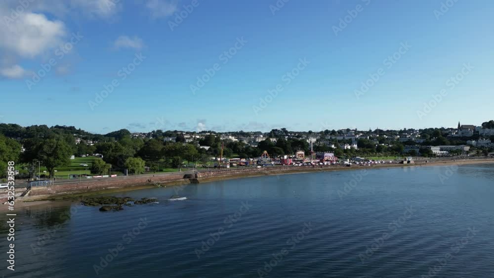 Torquay, Torbay, South Devon, England: DRONE VIEWS: The drone flies into the seashore at Torre Abbey Gardens for a view of the summer fairground / funfair. Torquay is a very popular UK holiday resort. Torquay, Torbay, South Devon, England: DRONE VIEWS: The drone flies into the seashore at Torre Abbey Gardens for a view of the summer fairground / funfair. Torquay is a very popular UK holiday resort.