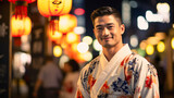 Portrait of young man wearing traditional Japanese casual summer kimono called 