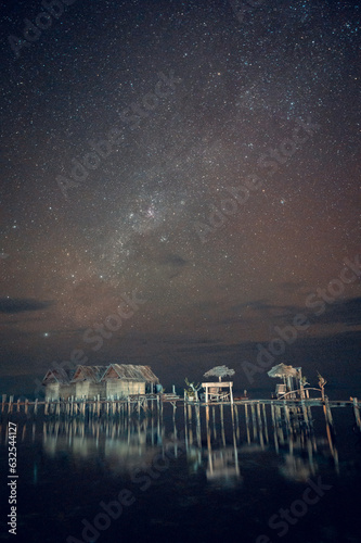 Night sky and Milky Way over the water bungalow on Arborek islan, Raja Amat, West Papua, Indonesia © Arthur
