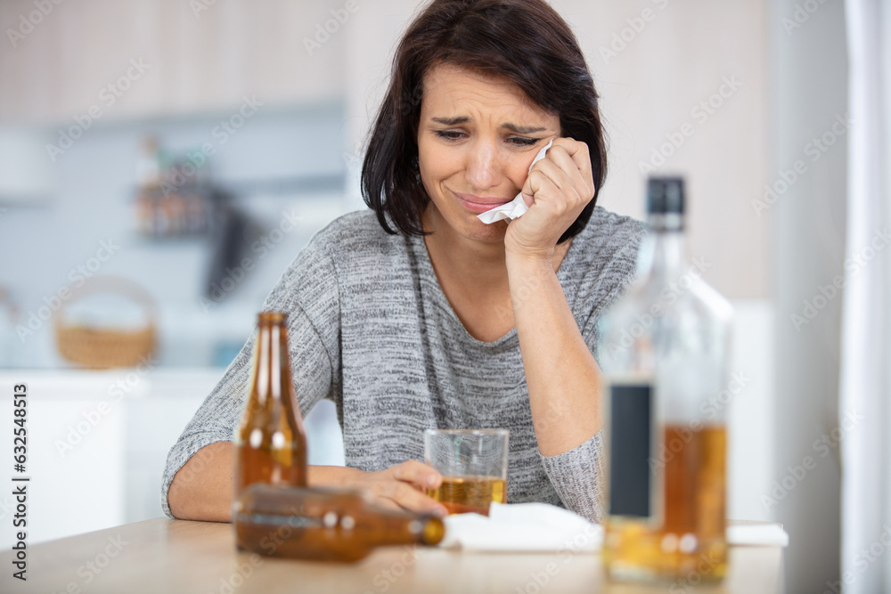 young brunette sitting by bar looking sad young brunette sitting by bar looking sad