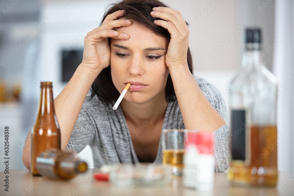 drunk depressed woman smoking and drinking at home drunk depressed woman smoking and drinking at home
