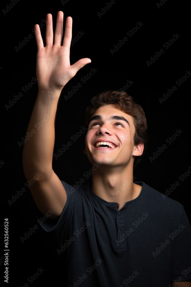 studio shot of a young man holding up copyspace studio shot of a young man holding up copyspace