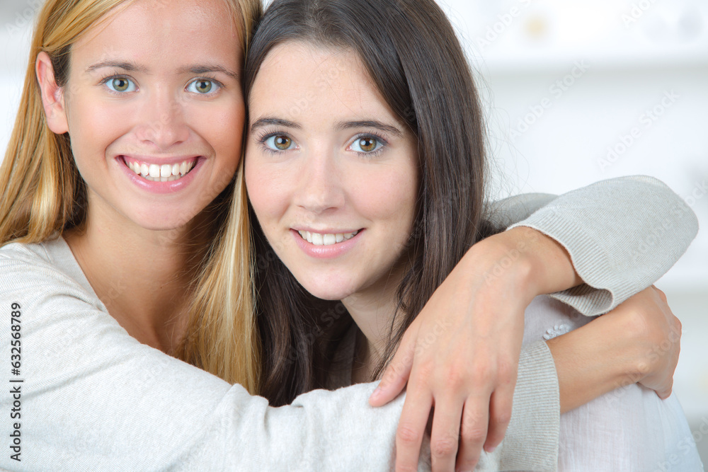 childhood friends are hugging in front of the camera childhood friends are hugging in front of the camera