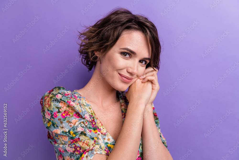 Photo portrait of attractive young woman hands together cute admire wear trendy flower print clothes isolated on violet color background Photo portrait of attractive young woman hands together cute admire wear trendy flower print clothes isolated on violet color background