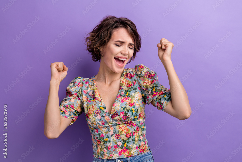 Photo of cheerful lady wear trendy blouse eyes closed shout yes celebrate black friday total sale isolated on purple color background Photo of cheerful lady wear trendy blouse eyes closed shout yes celebrate black friday total sale isolated on purple color background