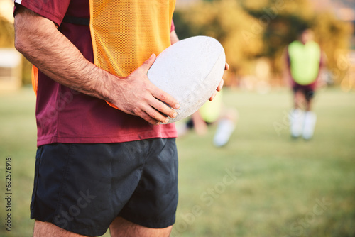 Rugby, man and hands with ball for sports games, competition and contest on field. Closeup of athlete, team player and training at stadium for fitness, exercise and performance of challenge outdoor